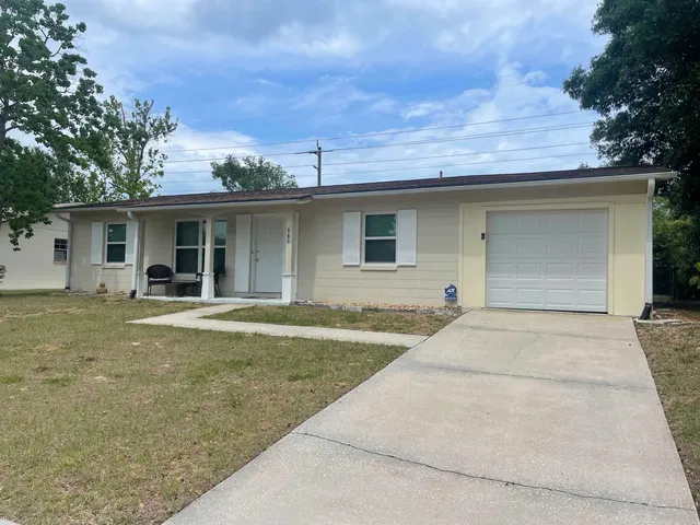 a view of outdoor space yard and front view of house