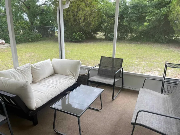 a balcony with furniture and city view