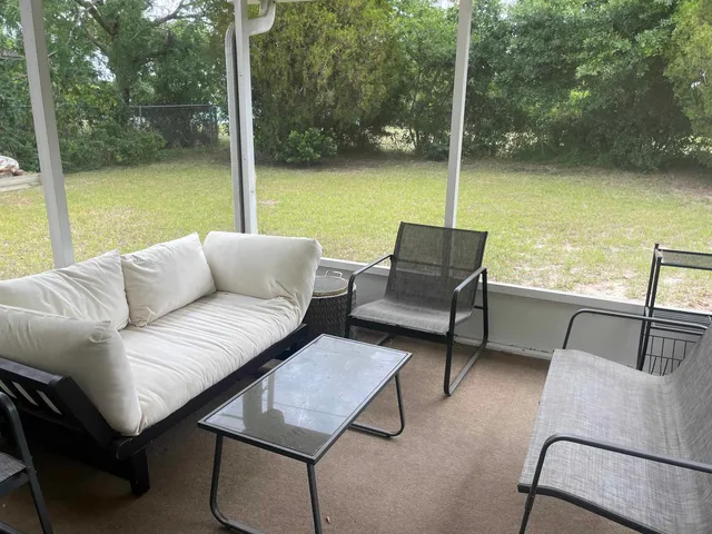 a balcony with furniture and city view