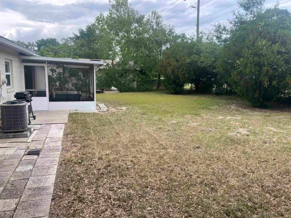 a view of backyard with green space