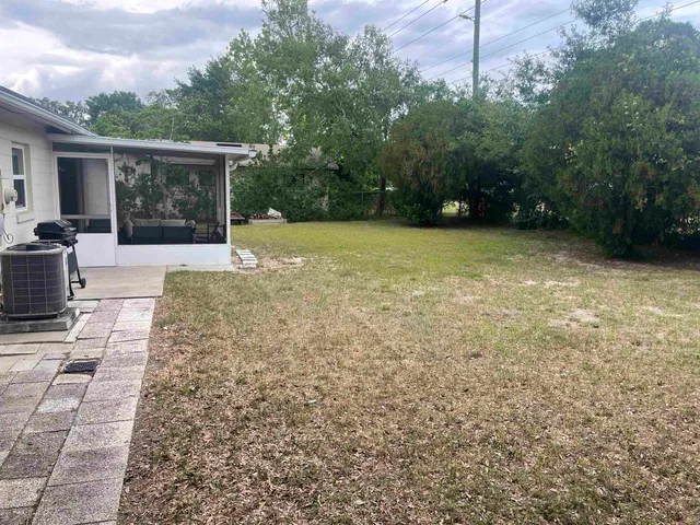 a view of backyard with green space