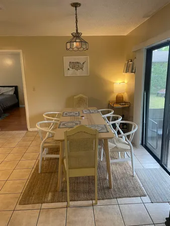 a dinning table and chairs in a room
