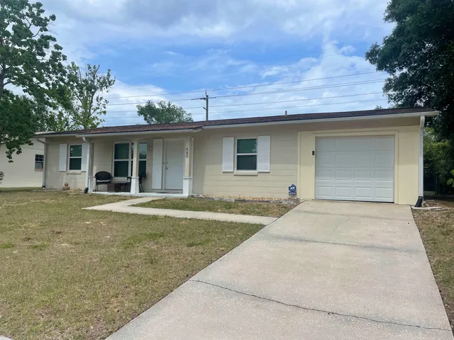 a view of outdoor space yard and front view of house
