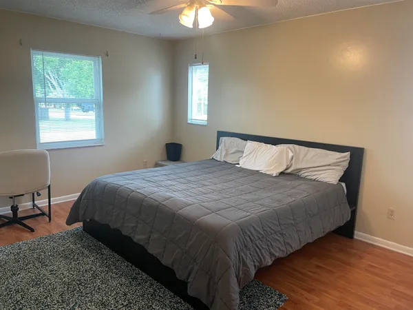 a bedroom with a bed and window