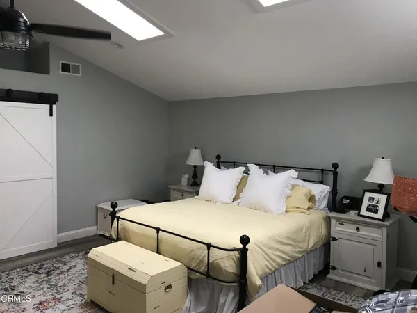 a bedroom with a bed and furniture