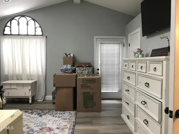a view of a livingroom with furniture and staircase