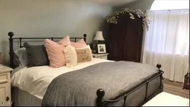 a bedroom with a bed and a cabinets