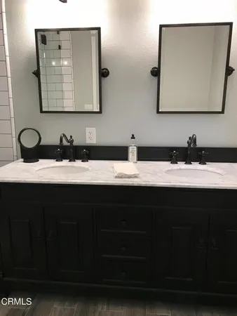 a bathroom with a sink toilet and mirror