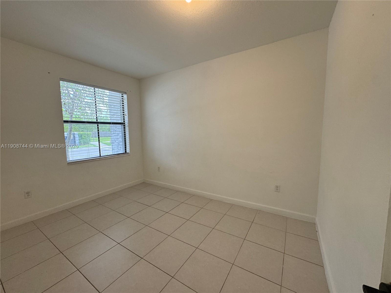 18240 Southwest 148th Road, Unit 18240 Miami, FL 33187 - Photo 16 of 30 an empty room with windows