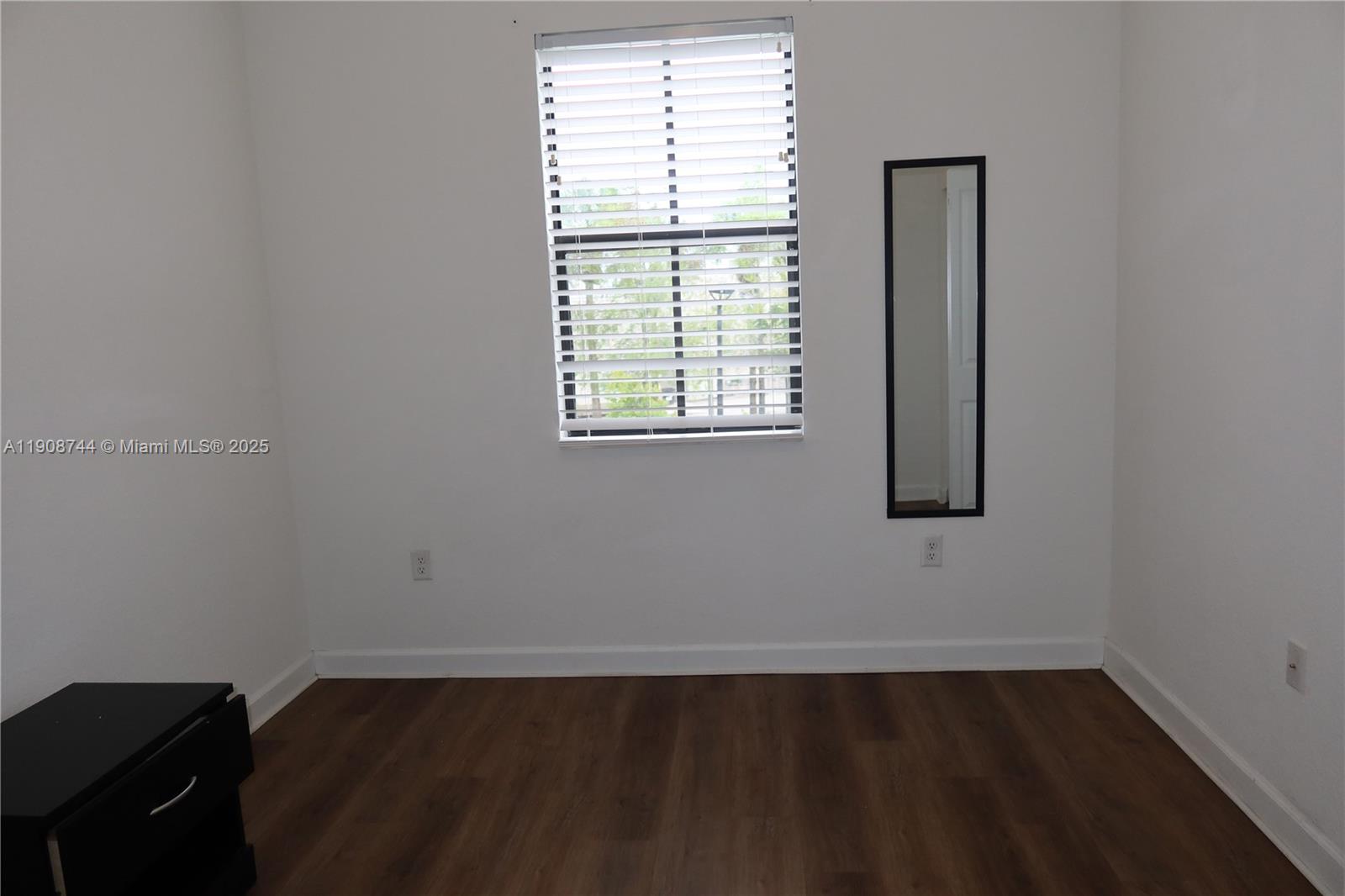 18240 Southwest 148th Road, Unit 18240 Miami, FL 33187 - Photo 19 of 30 an empty room with a window