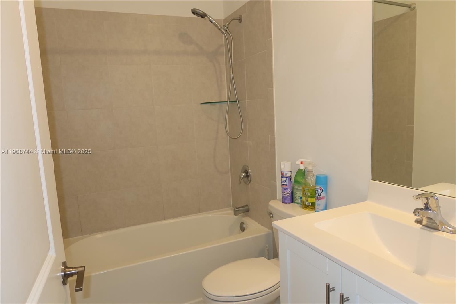18240 Southwest 148th Road, Unit 18240 Miami, FL 33187 - Photo 25 of 30 a bathroom with a sink toilet vanity and bathtub