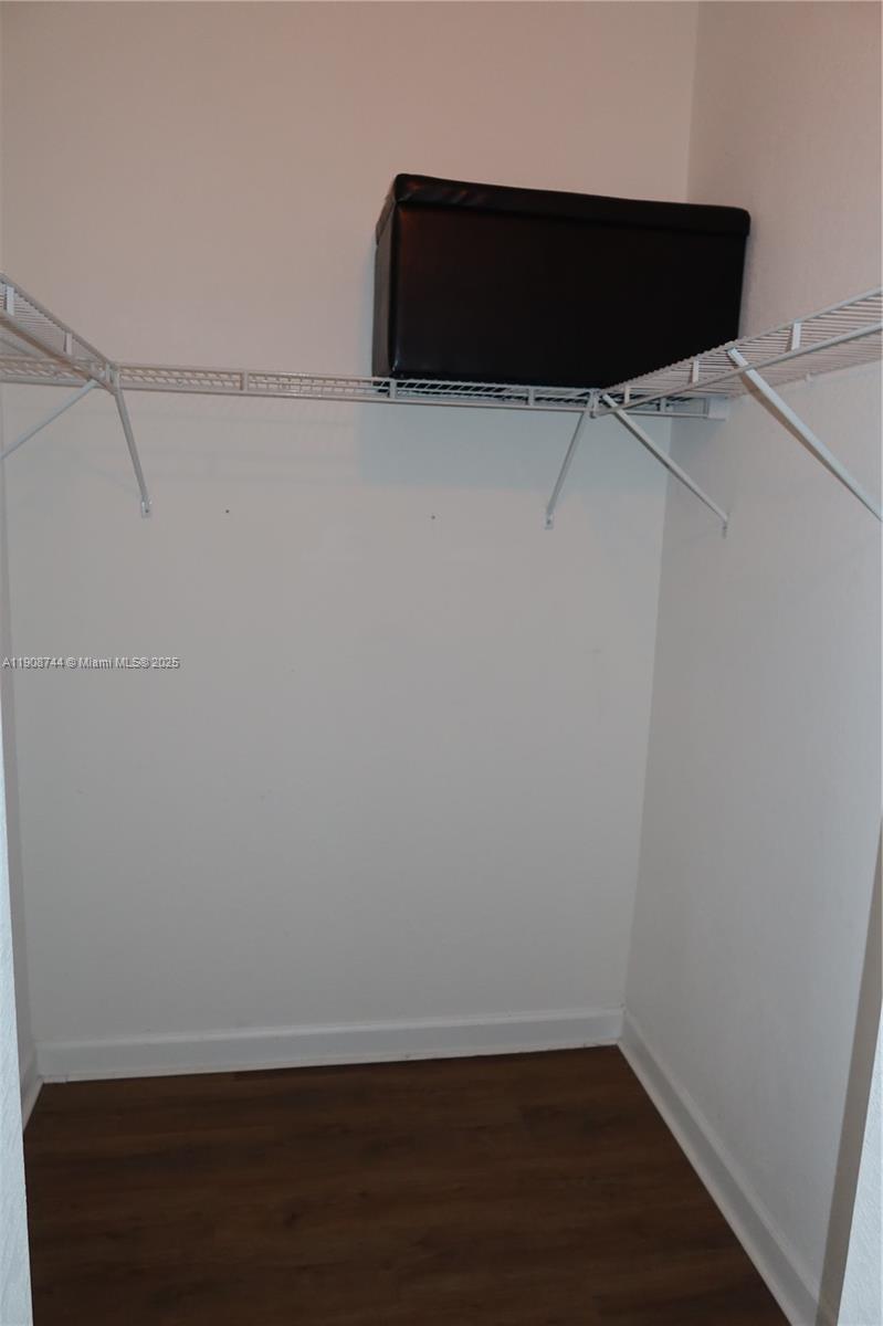 18240 Southwest 148th Road, Unit 18240 Miami, FL 33187 - Photo 27 of 30 a room with a bench