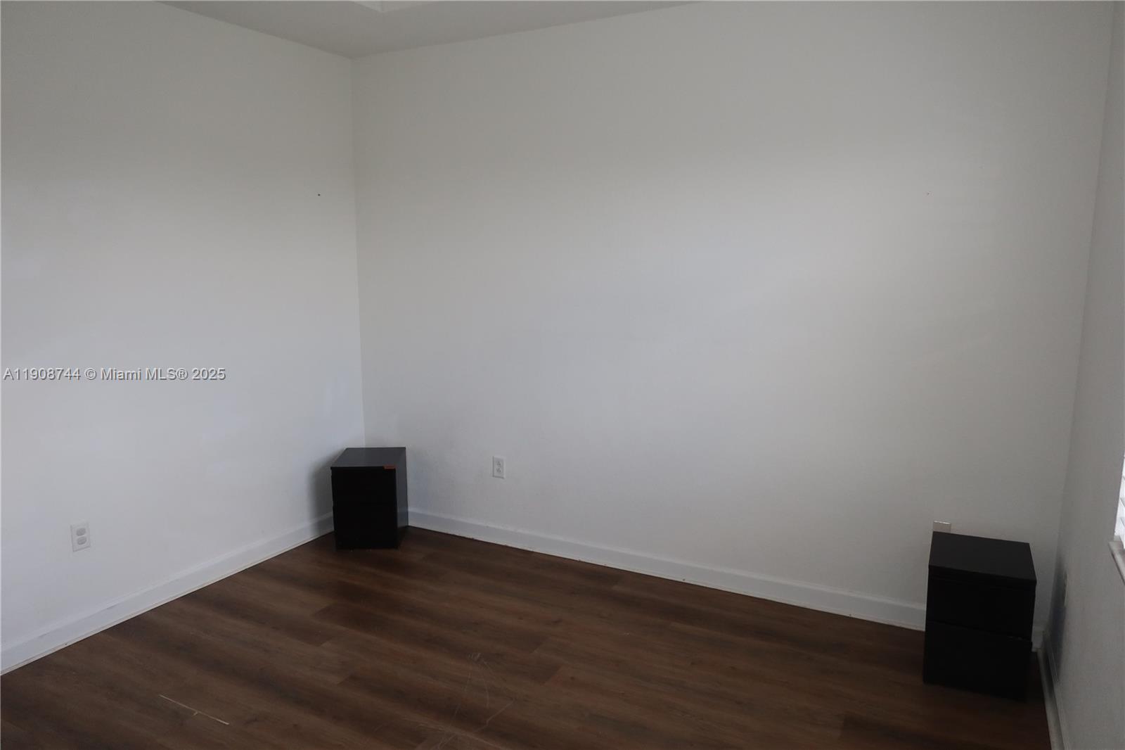 18240 Southwest 148th Road, Unit 18240 Miami, FL 33187 - Photo 30 of 30 a view of an empty room with wooden floor