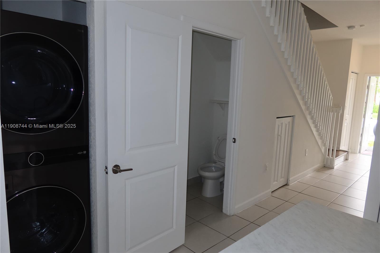 18240 Southwest 148th Road, Unit 18240 Miami, FL 33187 - Photo 9 of 30 a view of a closet and utility room