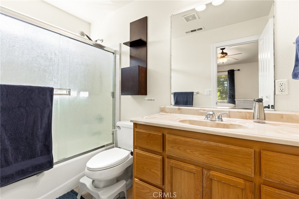 38 Kobe Loop Chico, CA 95973 - Photo 27 of 38 a bathroom with a granite countertop sink toilet and shower