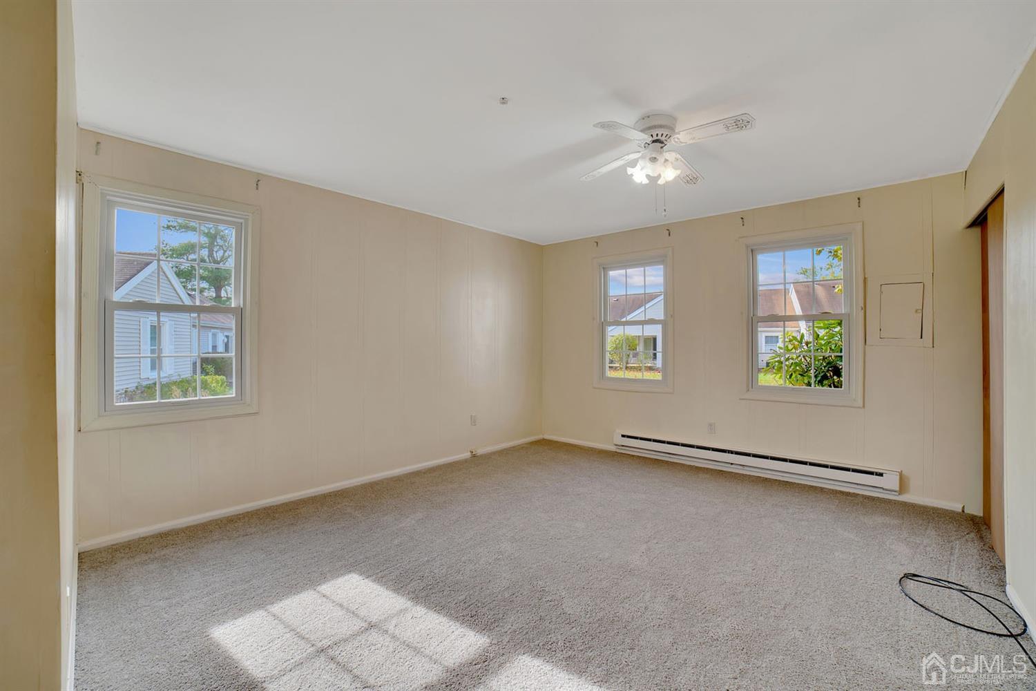 136 Rigi Strasse, Unit E Freehold, NJ 07728 - Photo 14 of 30 a view of an empty room with a window