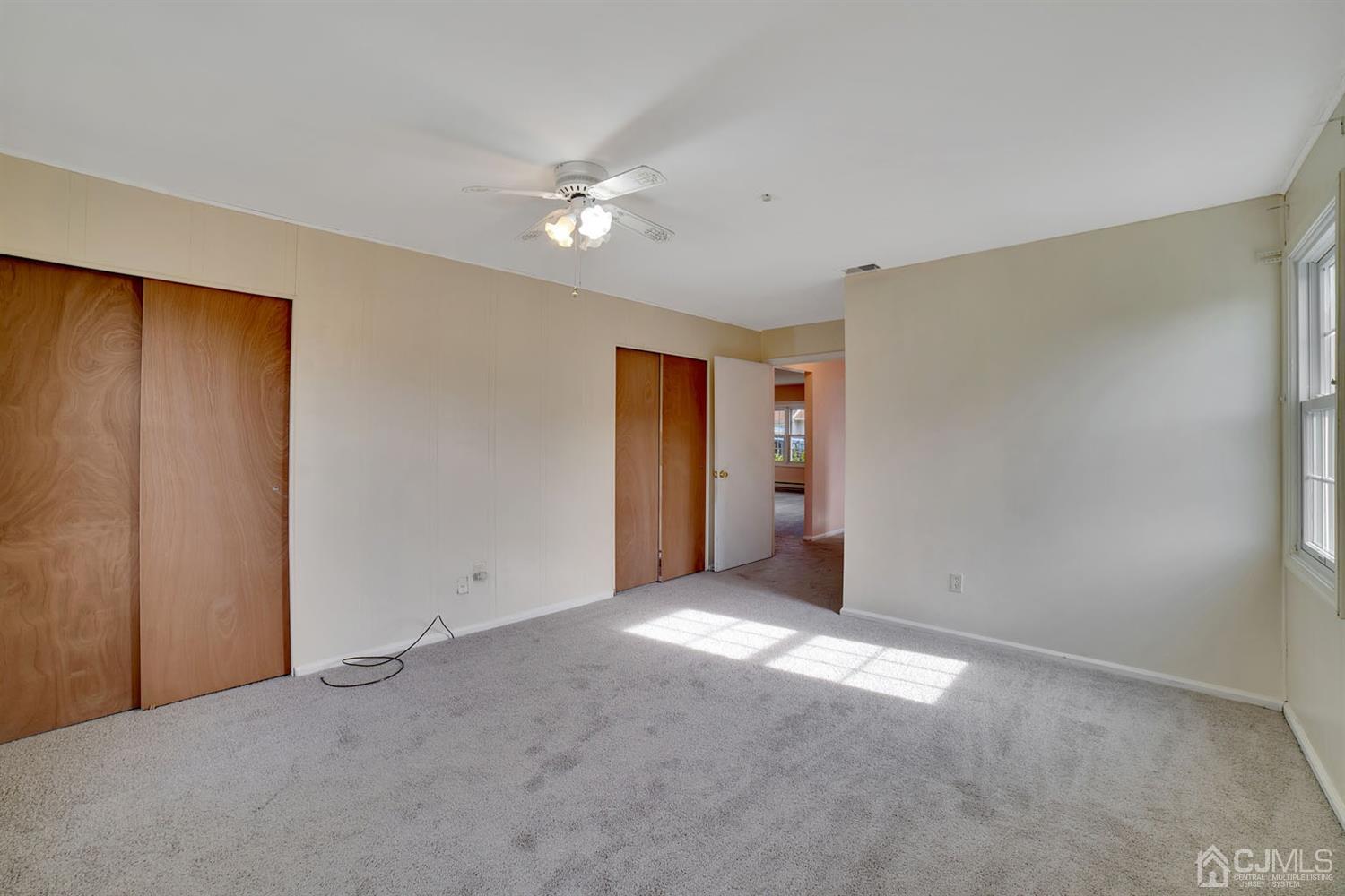 136 Rigi Strasse, Unit E Freehold, NJ 07728 - Photo 15 of 30 a view of an empty room with a bathroom