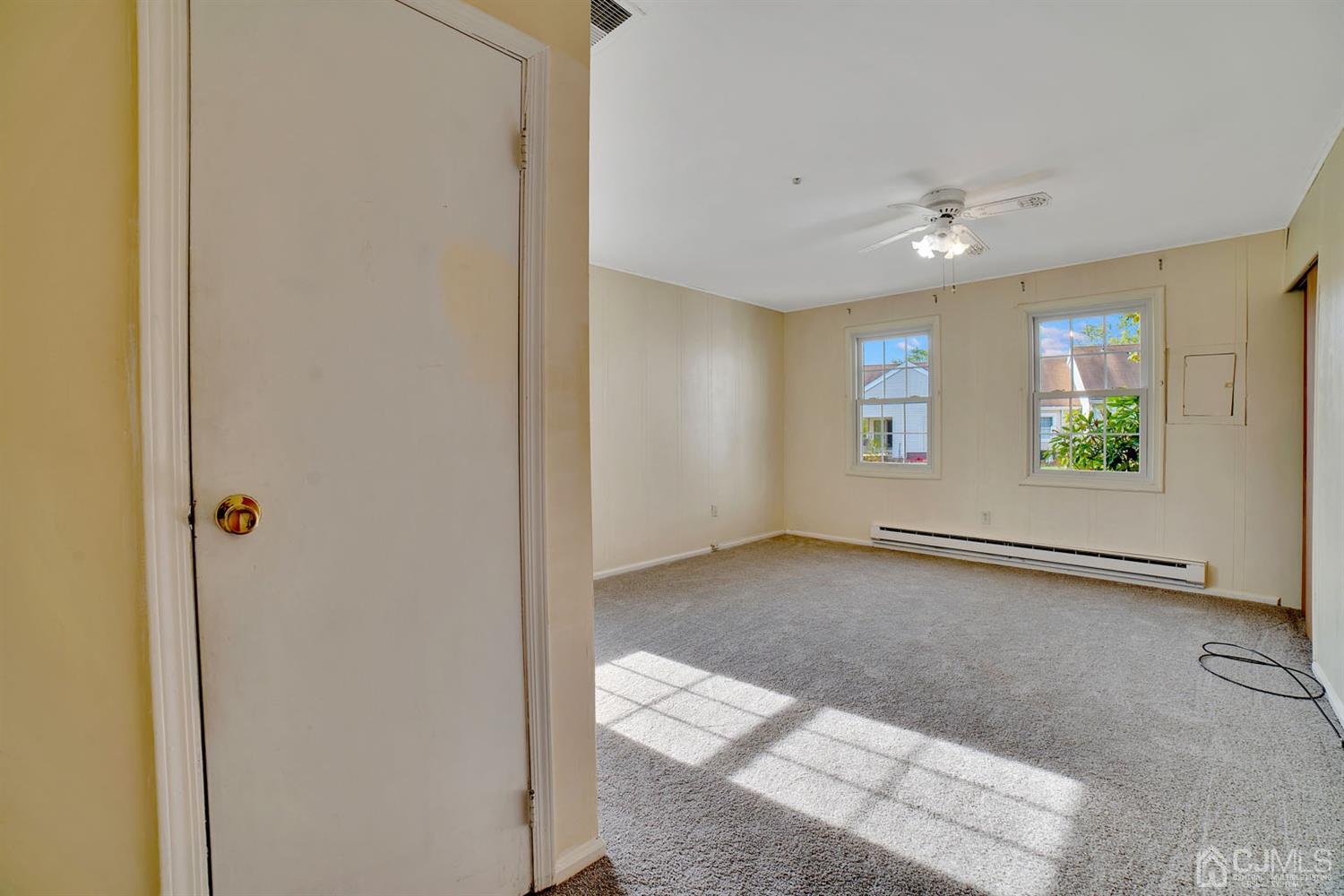136 Rigi Strasse, Unit E Freehold, NJ 07728 - Photo 16 of 30 a view of an empty room with a window
