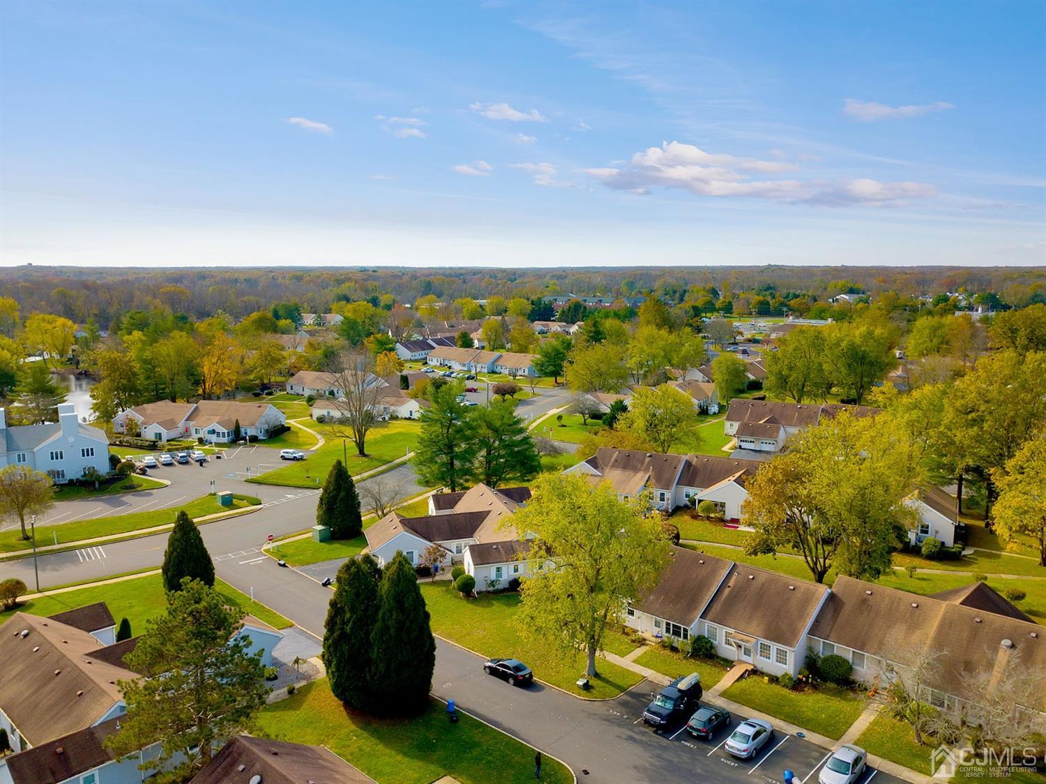 136 Rigi Strasse, Unit E Freehold, NJ 07728 - Photo 22 of 30 an aerial view of residential houses with outdoor space