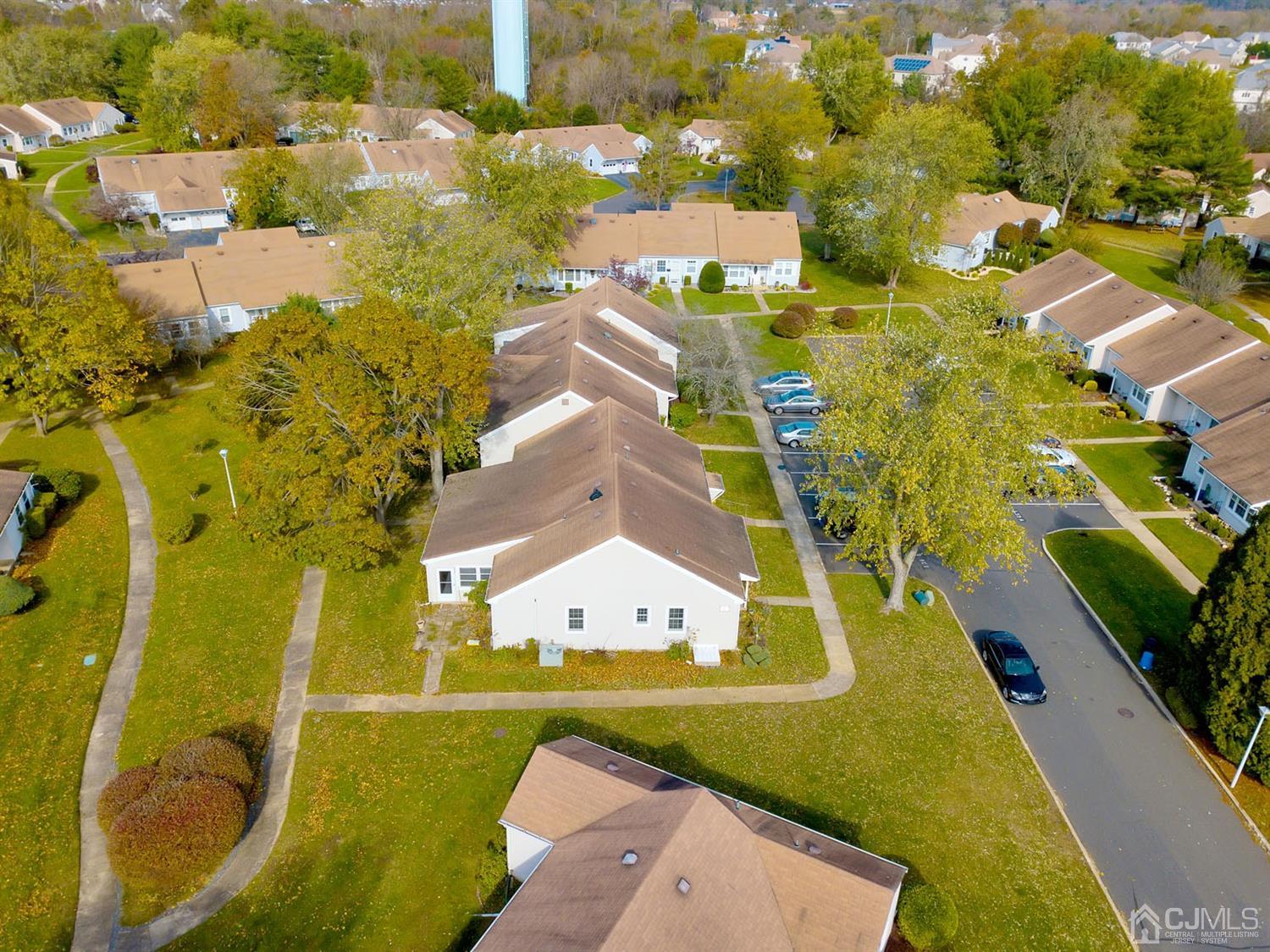 136 Rigi Strasse, Unit E Freehold, NJ 07728 - Photo 25 of 30 an aerial view of residential houses with outdoor space