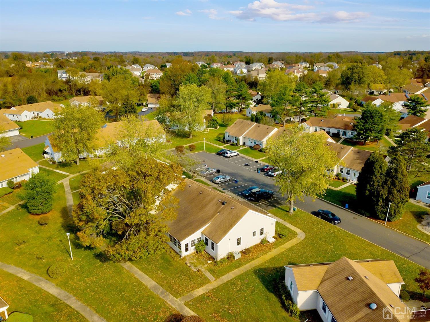 136 Rigi Strasse, Unit E Freehold, NJ 07728 - Photo 26 of 30 an aerial view of residential houses with outdoor space