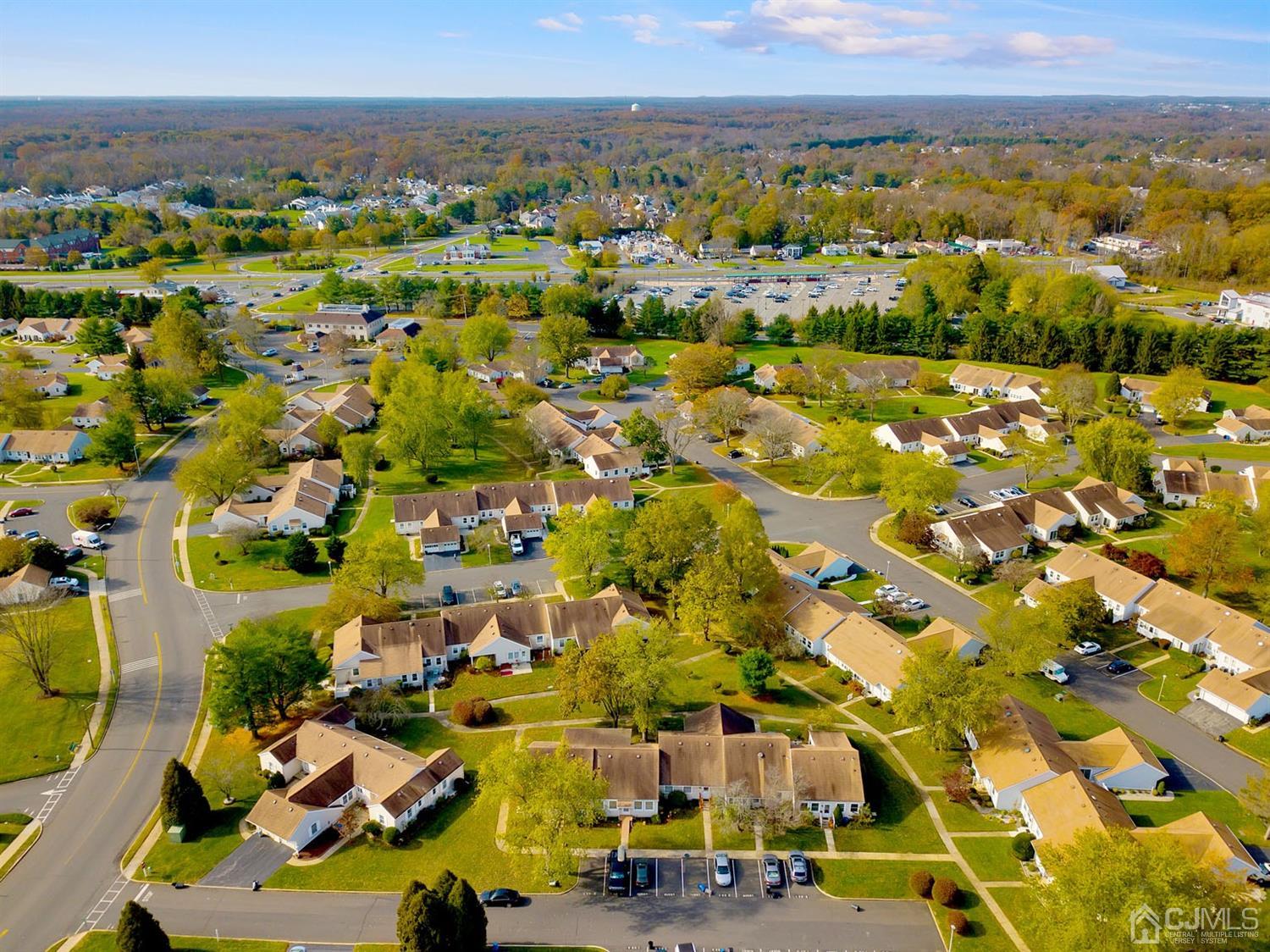 136 Rigi Strasse, Unit E Freehold, NJ 07728 - Photo 27 of 30 an aerial view of residential houses with outdoor space