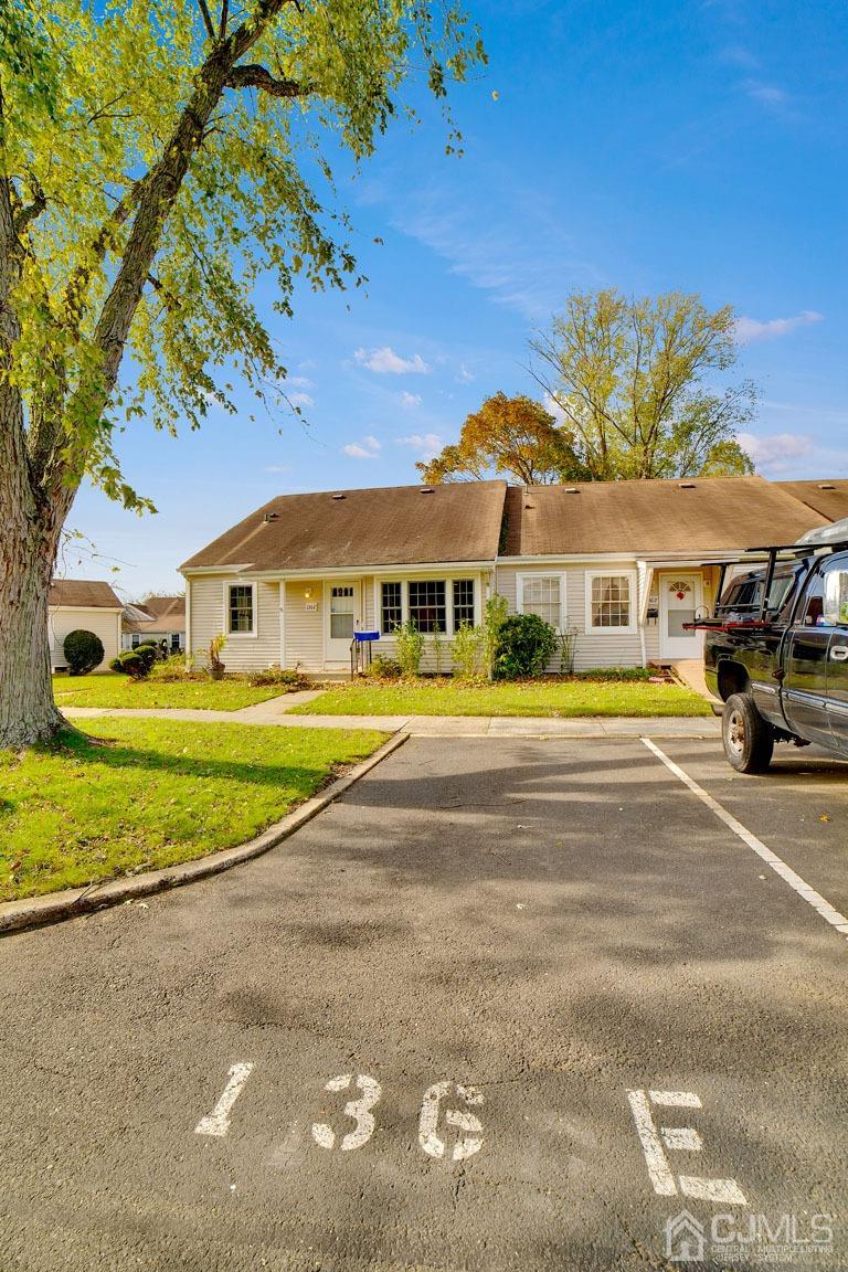 136 Rigi Strasse, Unit E Freehold, NJ 07728 - Photo 7 of 30 a view of house with a swimming pool