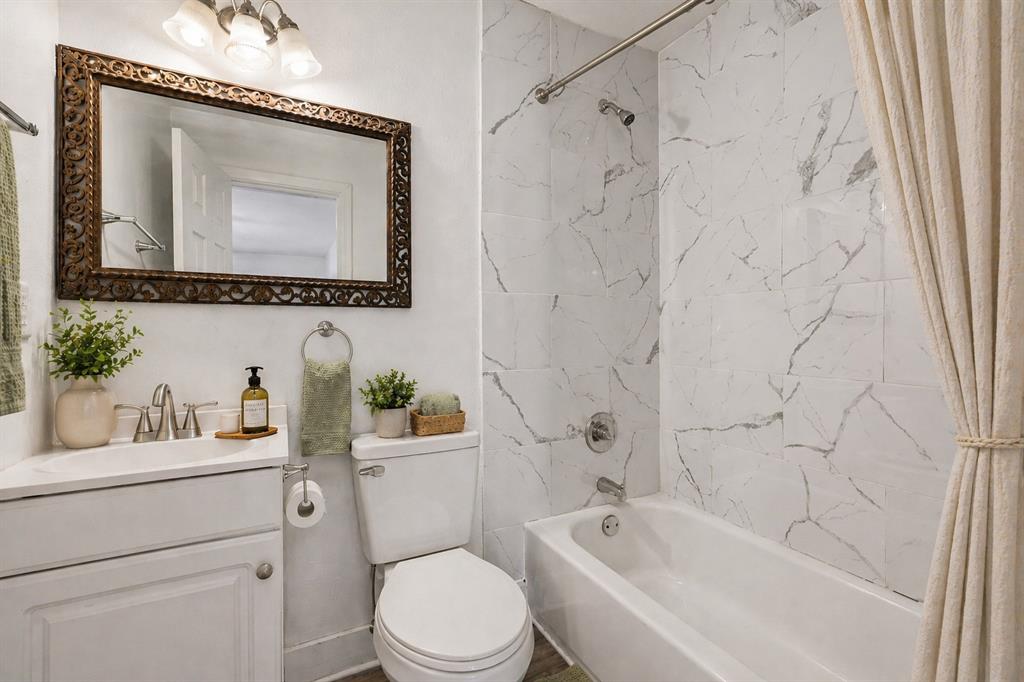 803 East 14th Street Bonham, TX 75418 - Photo 6 of 22 Virtually staged bathroom