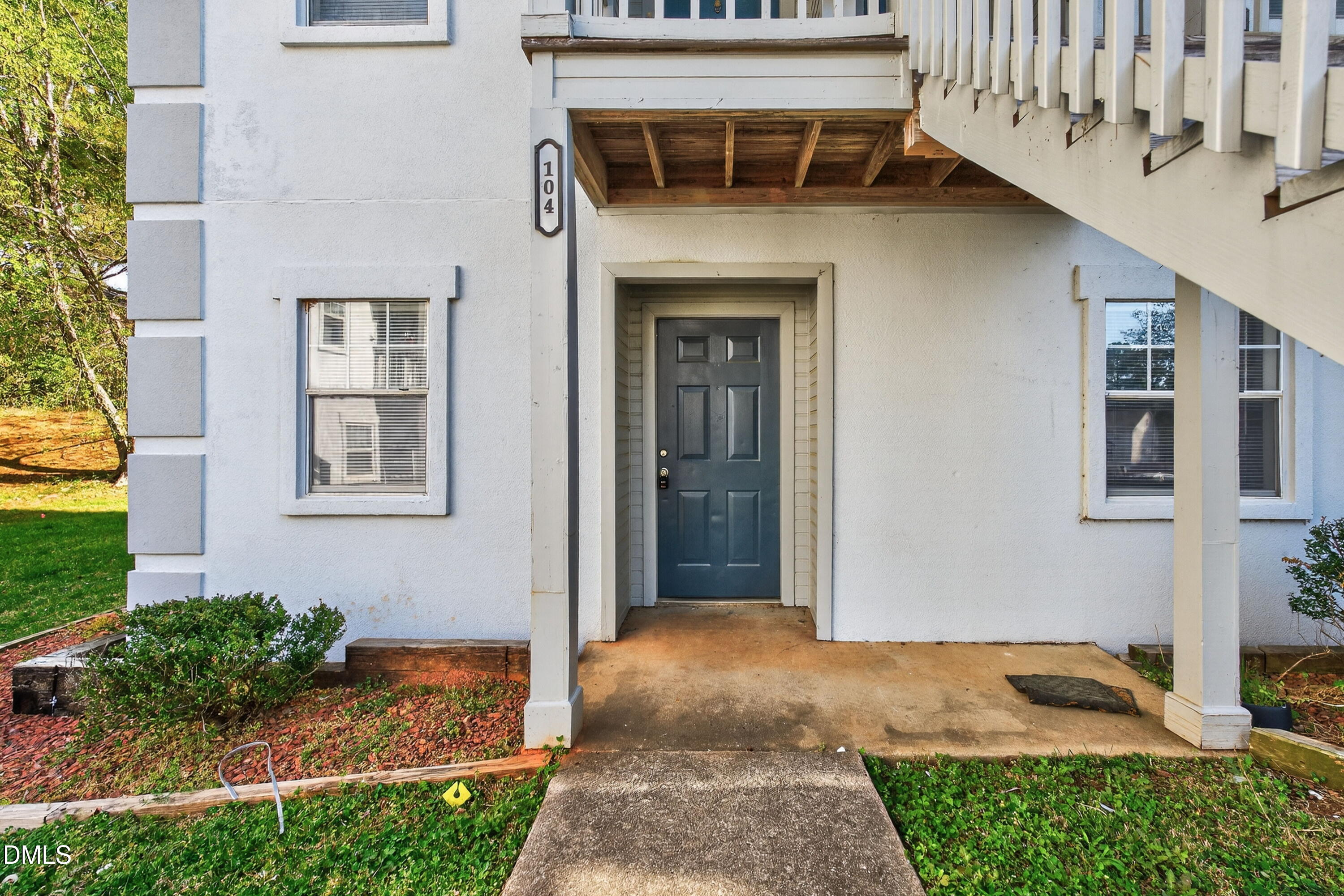 2510 Avent Ferry Road, Unit 104 Raleigh, NC 27606 - Photo 3 of 26 a front view of a house with a yard