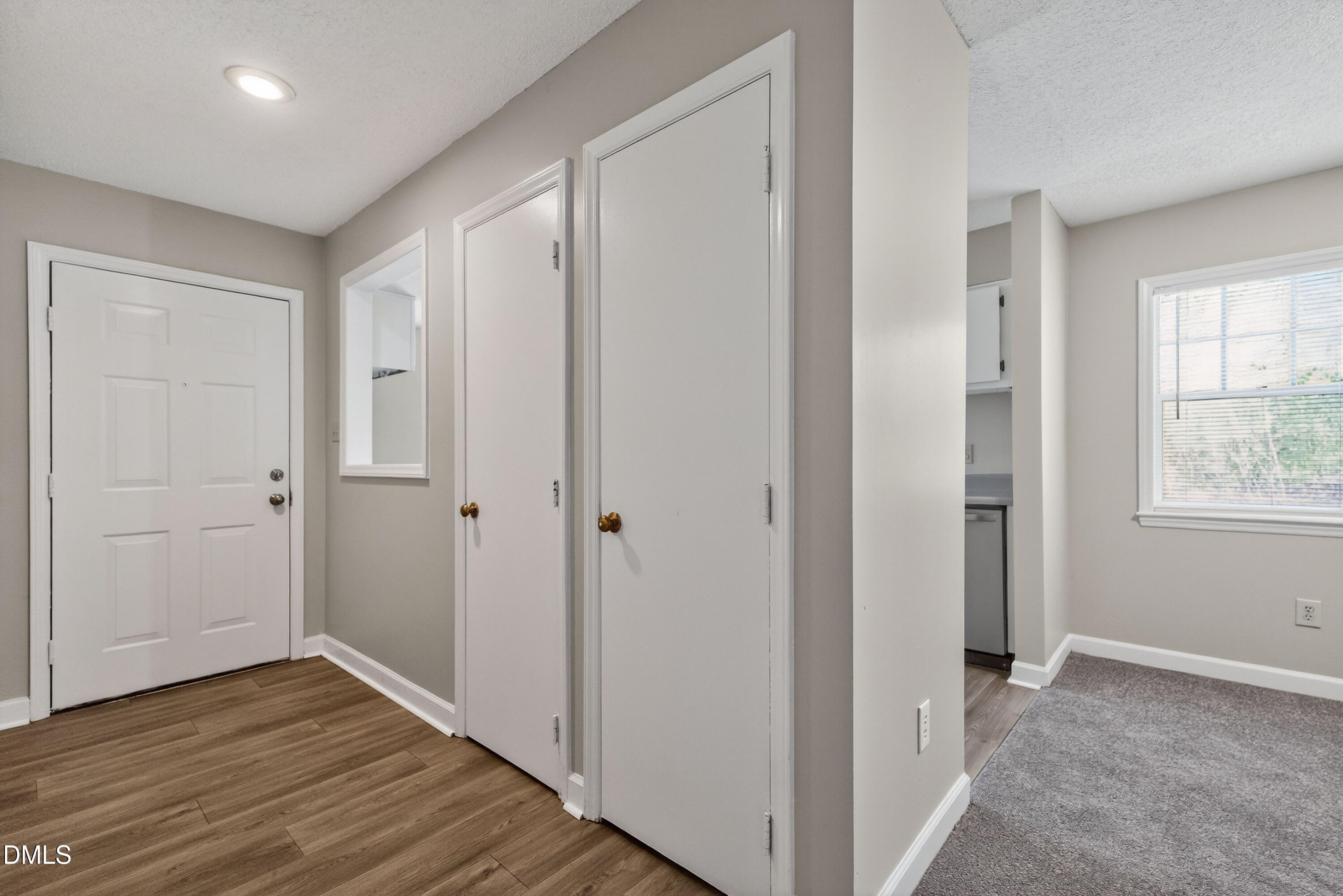2510 Avent Ferry Road, Unit 104 Raleigh, NC 27606 - Photo 4 of 26 a view of hallway with wooden floor