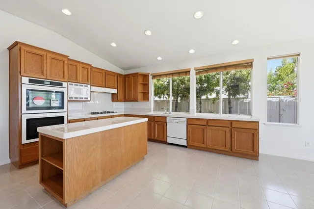 a kitchen that has a sink and a stove