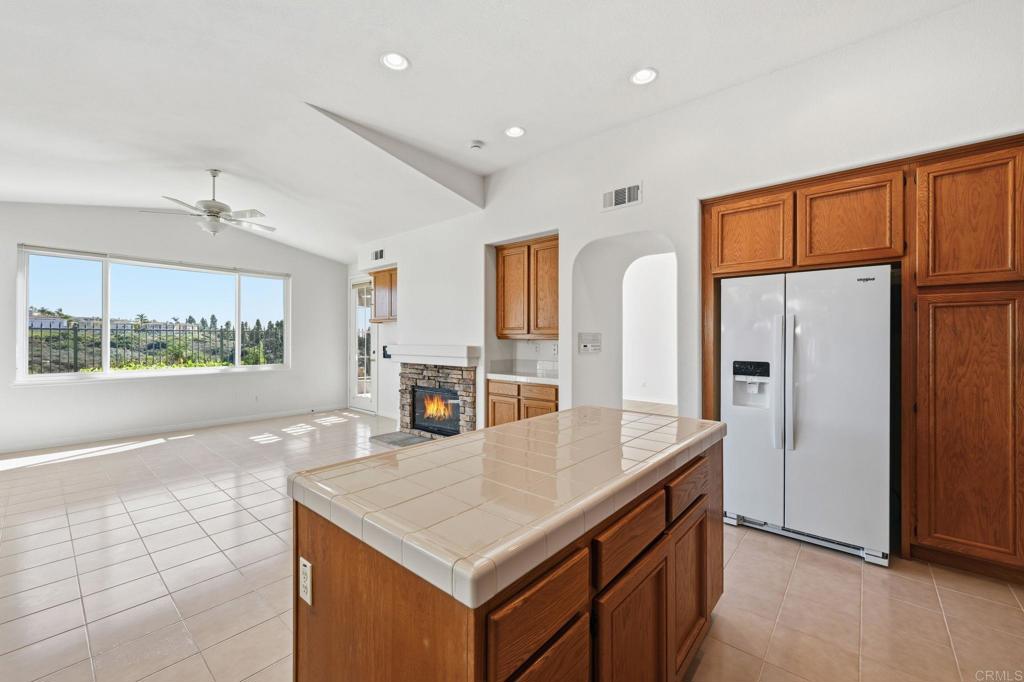 1359 Sparrow Road Carlsbad, CA 92011 - Photo 16 of 43 a kitchen with stainless steel appliances granite countertop a refrigerator a stove and a sink with large window