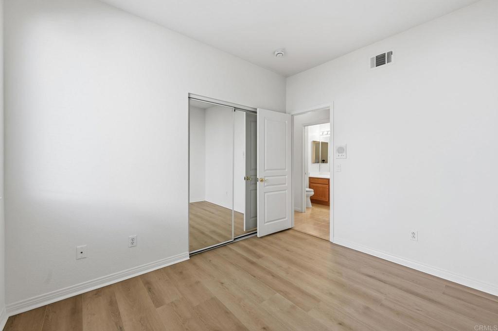 1359 Sparrow Road Carlsbad, CA 92011 - Photo 25 of 43 an empty room with wooden floor