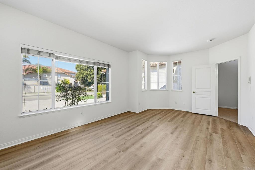 1359 Sparrow Road Carlsbad, CA 92011 - Photo 30 of 43 a view of an empty room with wooden floor and a window