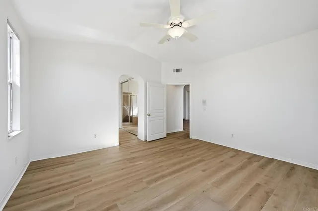 a spacious bathroom with a shower sink and mirror
