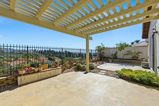 a view of a swimming pool and outdoor seating
