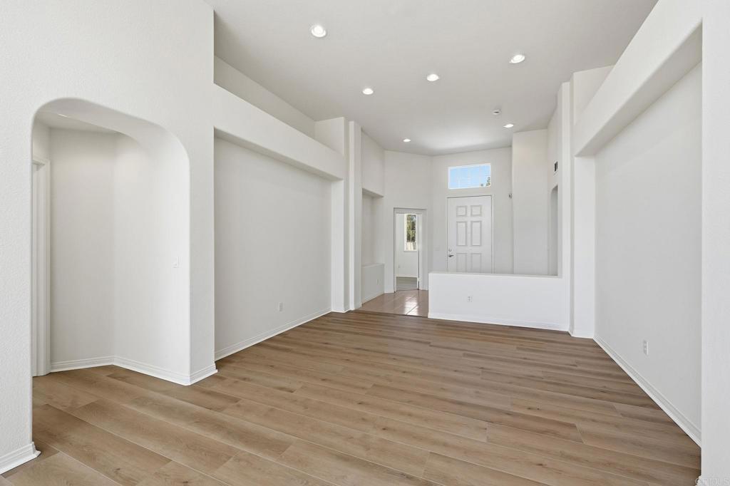 1359 Sparrow Road Carlsbad, CA 92011 - Photo 9 of 43 a big room with wooden floor and a bathroom