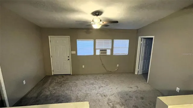 a view of an empty room and window