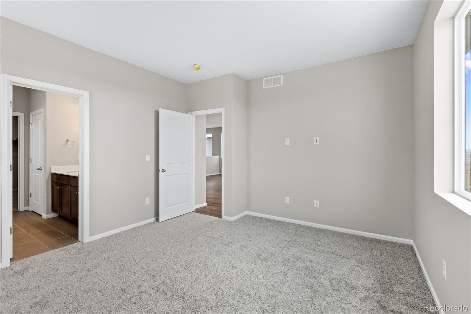 6028 Keyser Place Brighton, CO 80601 - Photo 11 of 26 an empty room with windows