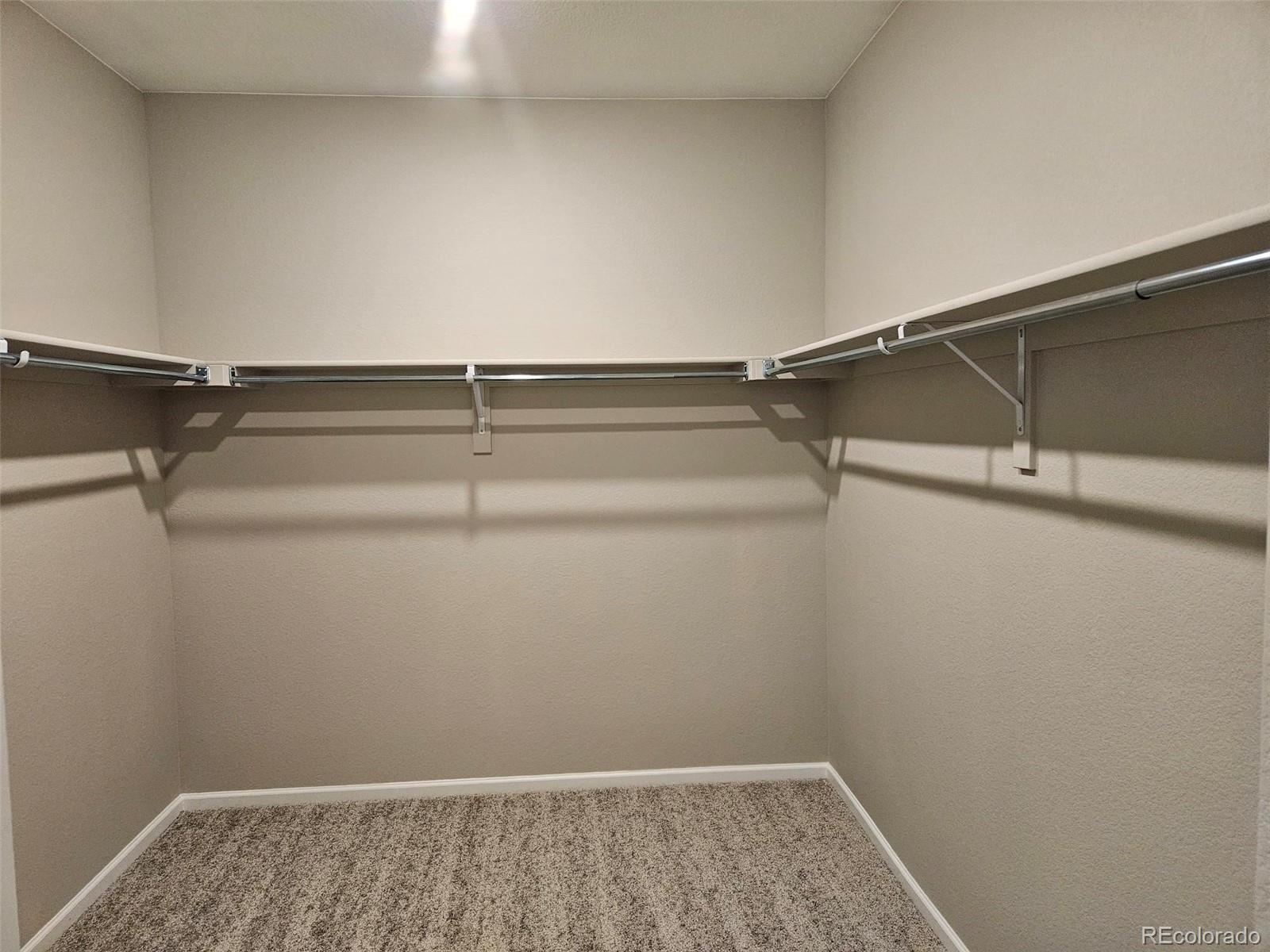 6028 Keyser Place Brighton, CO 80601 - Photo 13 of 14 a view of a room with racks on the wall