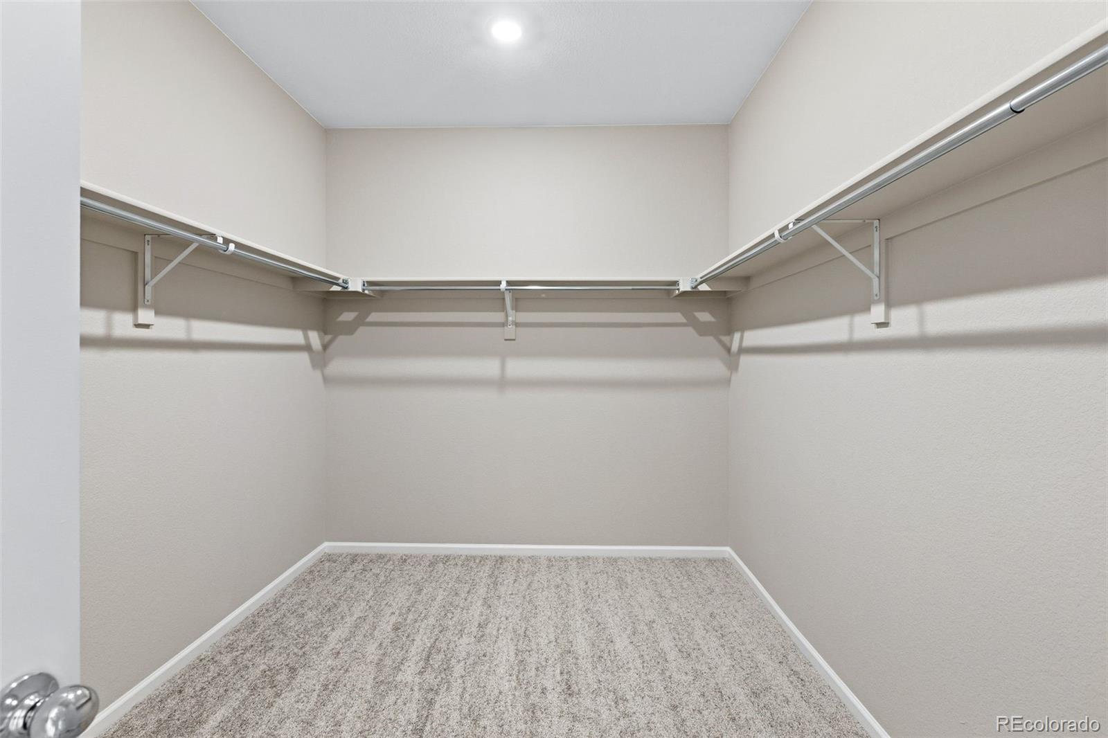 6028 Keyser Place Brighton, CO 80601 - Photo 14 of 26 a view of a room with racks on the wall