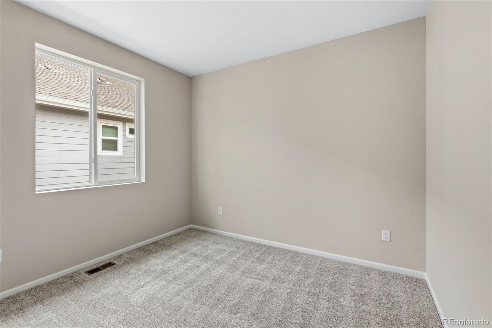 6028 Keyser Place Brighton, CO 80601 - Photo 15 of 26 an empty room with a window
