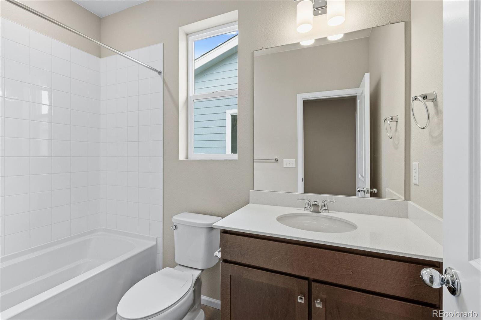 6028 Keyser Place Brighton, CO 80601 - Photo 17 of 26 a bathroom with a sink toilet tub and shower