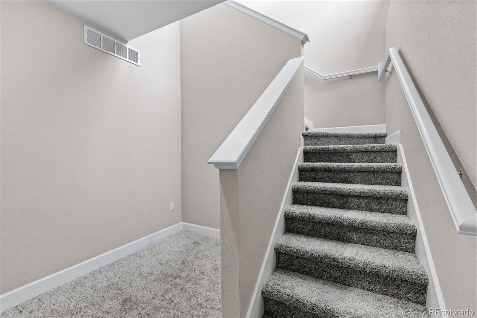 6028 Keyser Place Brighton, CO 80601 - Photo 22 of 26 a view of staircase with white walls