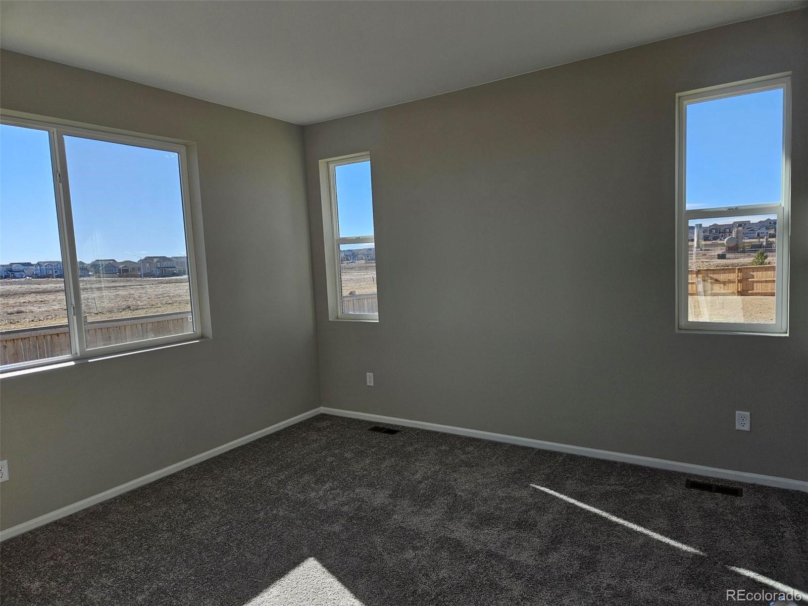 6028 Keyser Place Brighton, CO 80601 - Photo 10 of 14 an empty room with a window