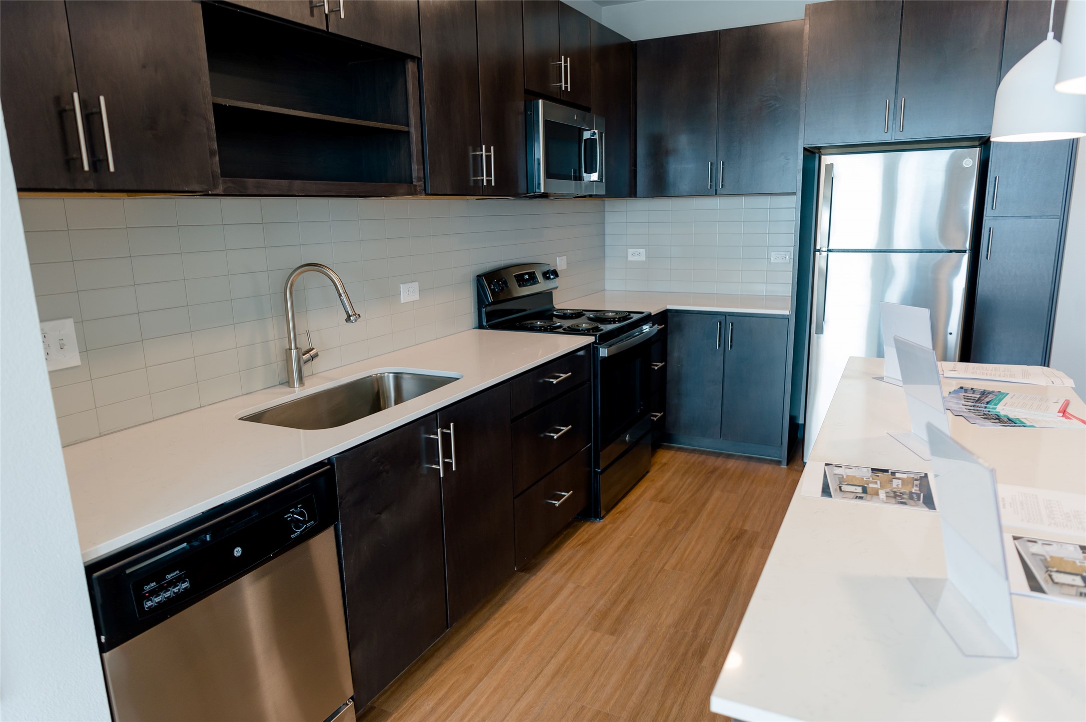 5310 Helen Street, Unit STUDIO Austin, TX 78751 - Photo 3 of 23 a kitchen with stainless steel appliances a sink dishwasher stove and refrigerator