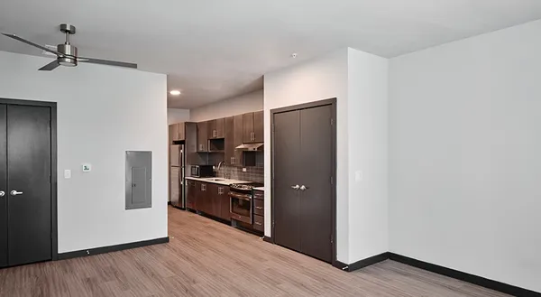 a kitchen with stainless steel appliances a sink dishwasher stove and refrigerator