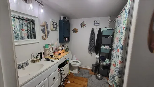 a view of a workspace with furniture and gym equipment