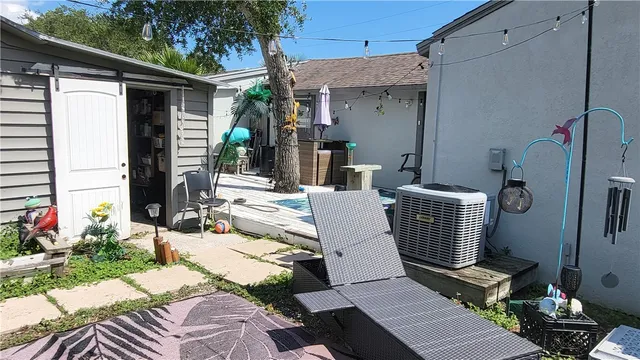 a view of a patio filled with furniture