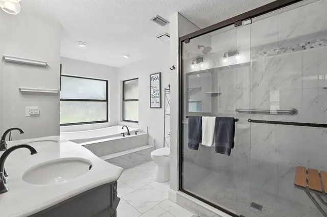 a view of a livingroom with workspace and a window